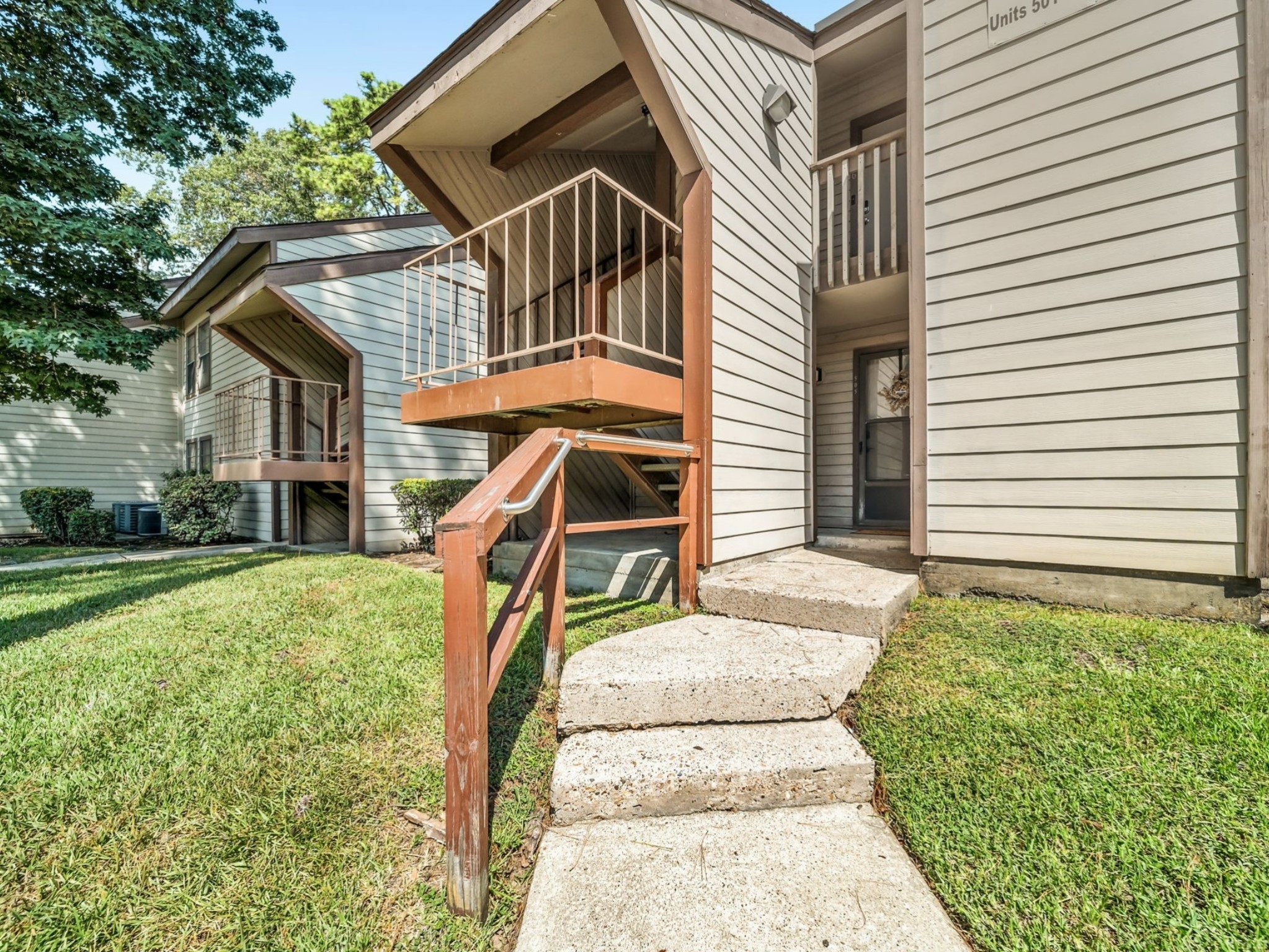 12900 Walden Road, Unit 505 Montgomery, TX 77356 - Photo 49 of 50 a view of a house with a yard