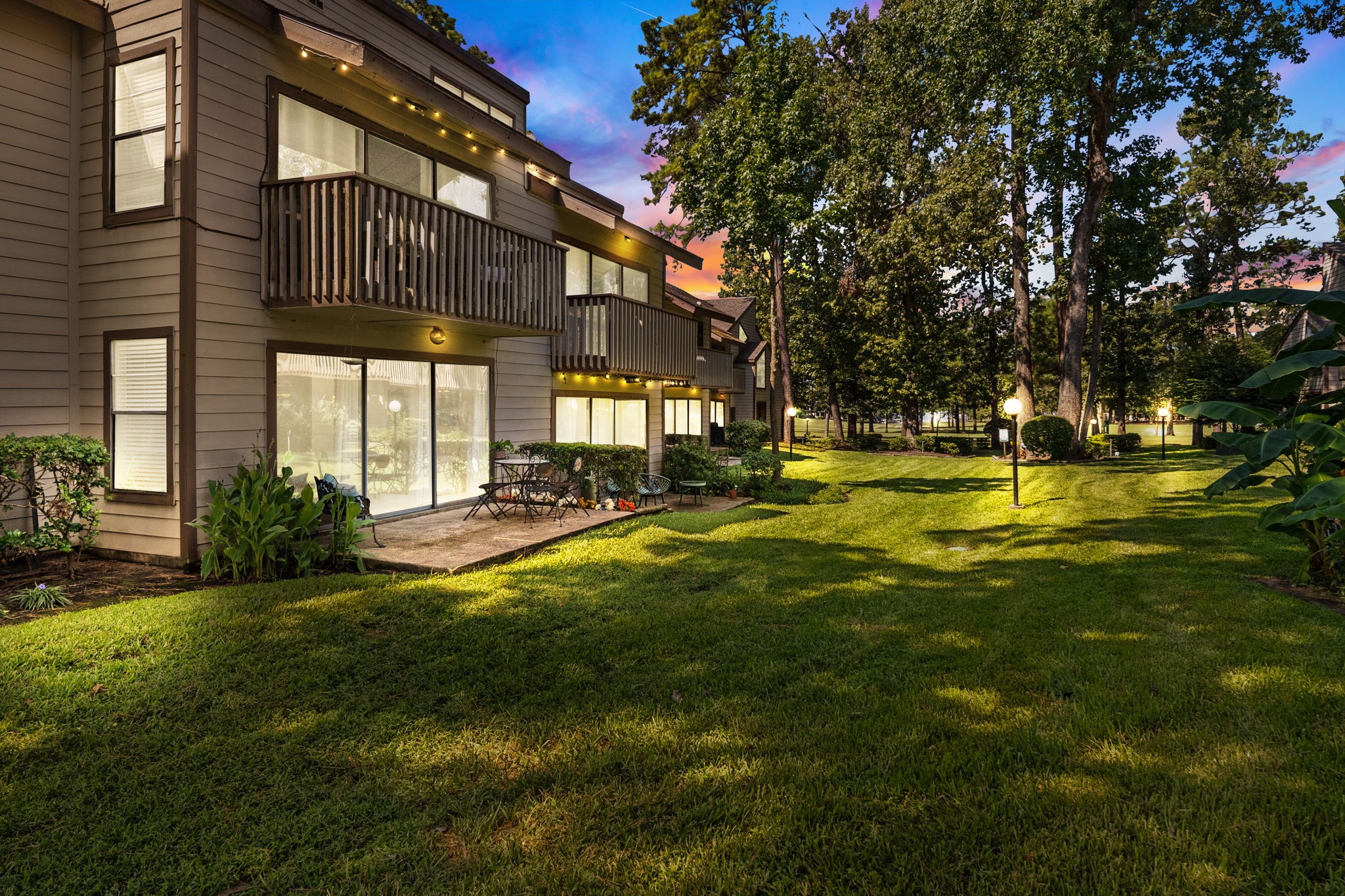 12900 Walden Road, Unit 505 Montgomery, TX 77356 - Photo 5 of 50 a swimming pool with outdoor seating and yard