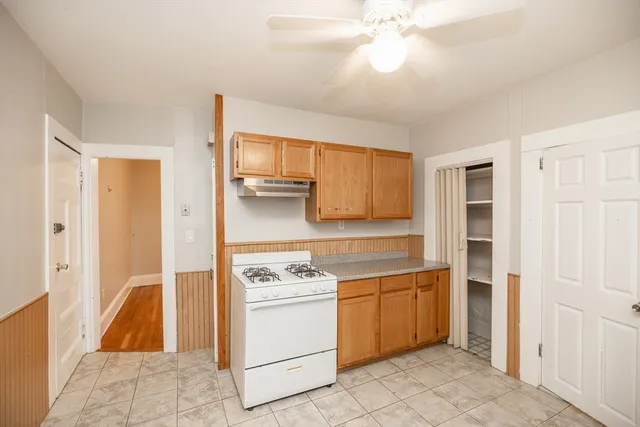 a utility room with cabinets washer and dryer
