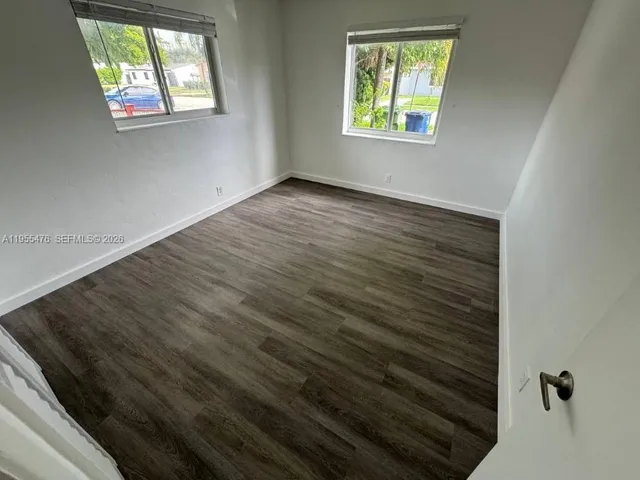 an empty room that has a window