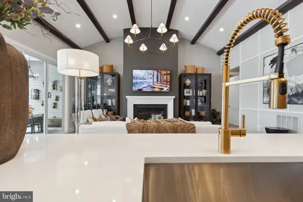 a view of living room with furniture and a fireplace
