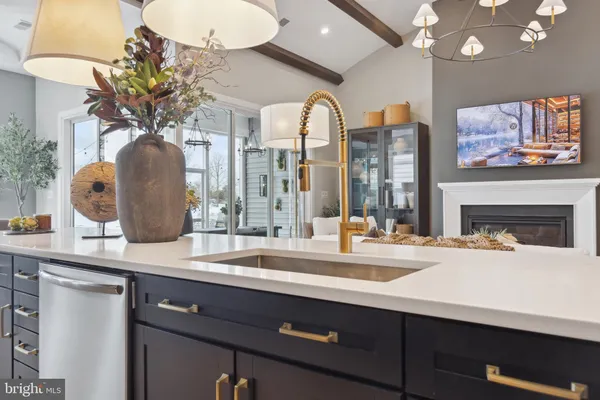 a close view of sink and cabinets