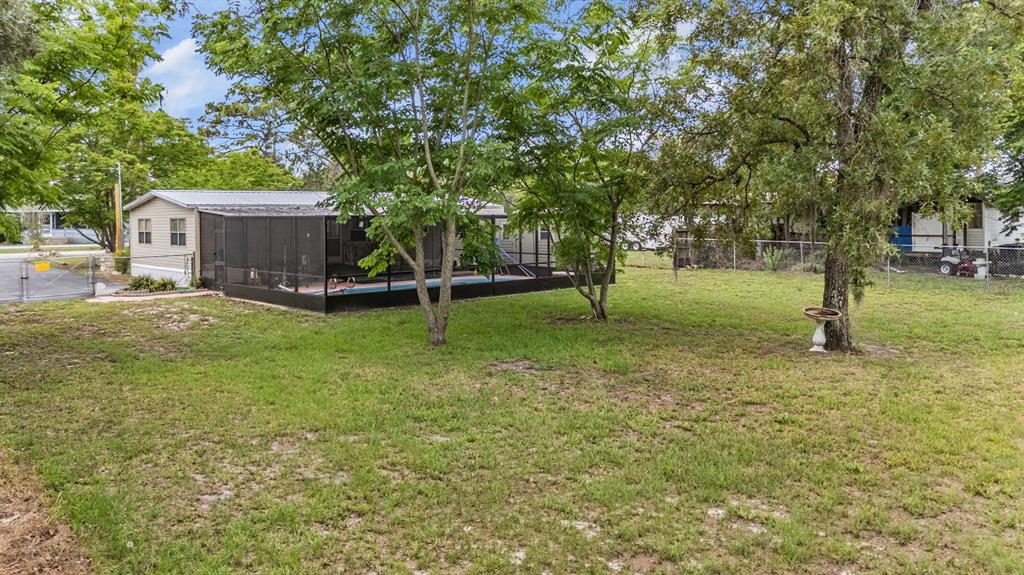 9739 Ray Street Hudson, FL 34669 - Photo 6 of 36 a view of a yard with a house