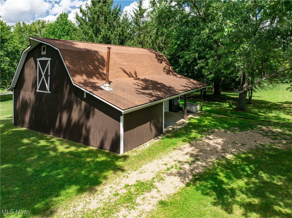 749 Hartman Road Wadsworth, OH 44281 - Photo 45 of 49 View of outdoor structure with a yard