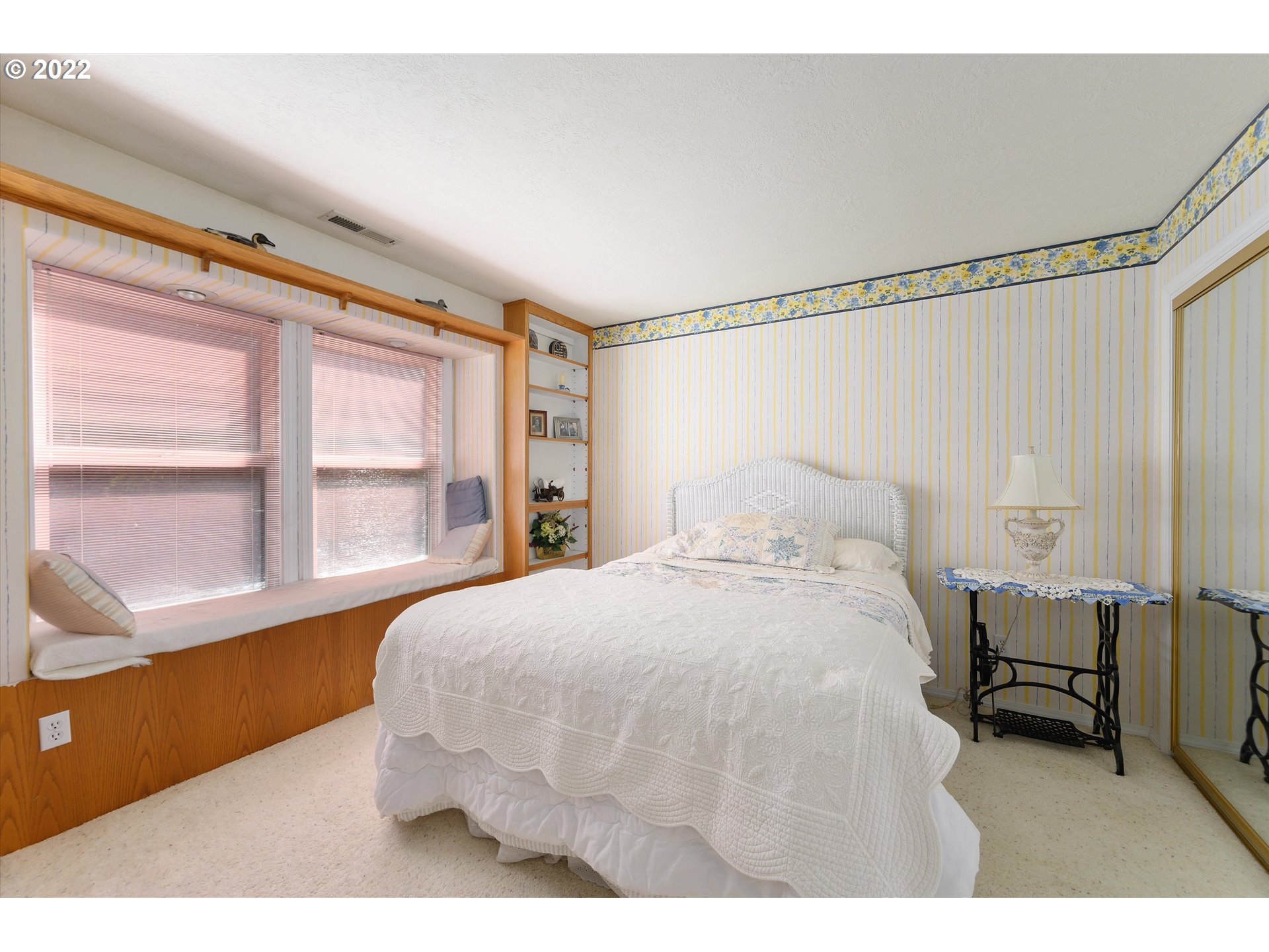 16750 Oakdale Road Dallas, OR 97338 - Photo 19 of 32 a bedroom with a bed mirror and a window