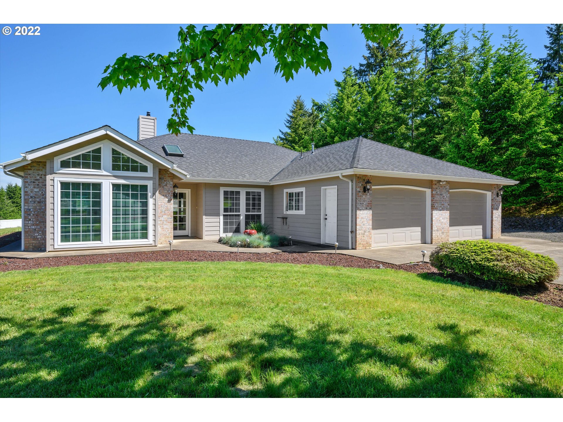 16750 Oakdale Road Dallas, OR 97338 - Photo 2 of 32 a front view of a house with a yard