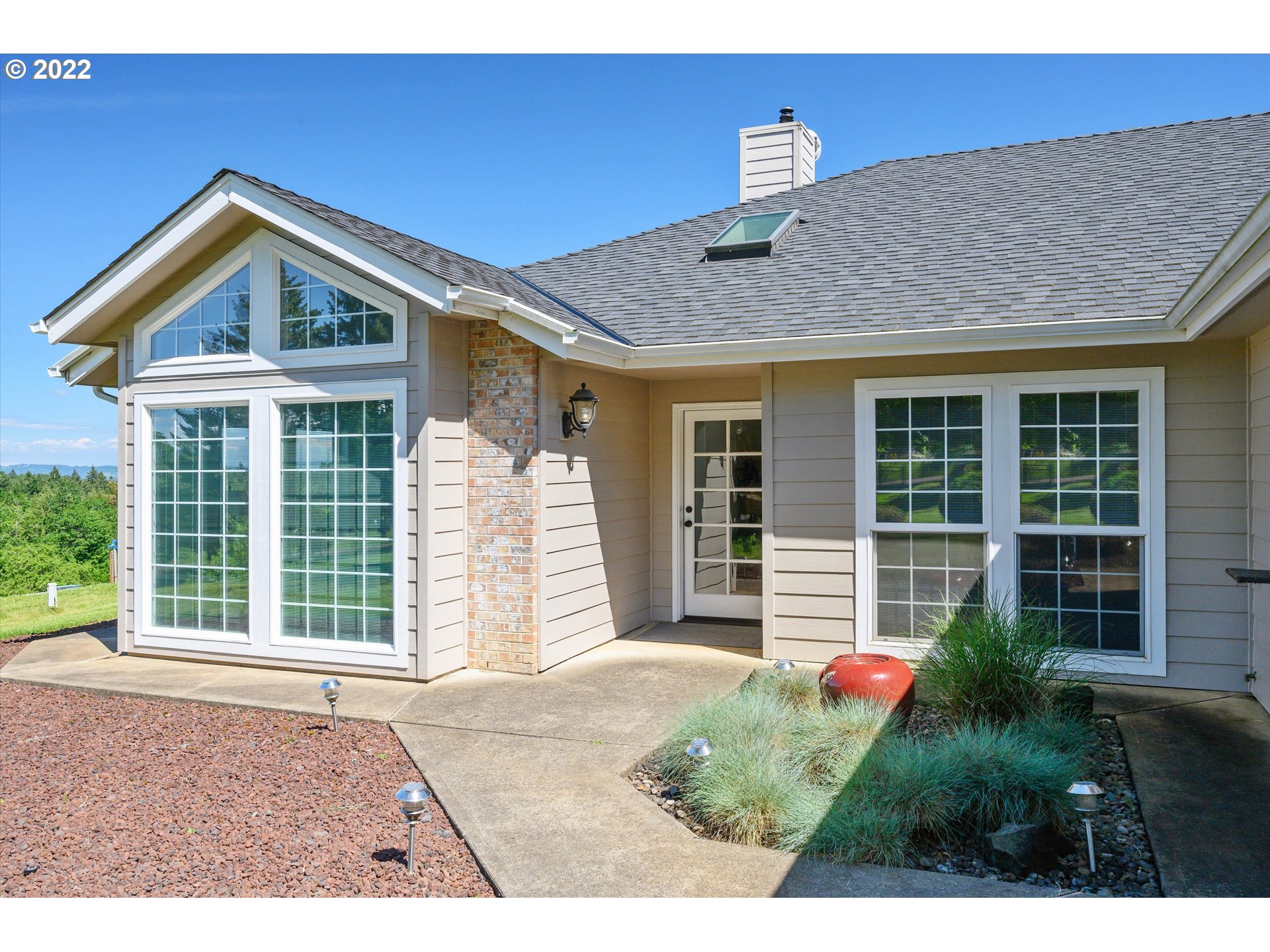 16750 Oakdale Road Dallas, OR 97338 - Photo 3 of 32 a front view of a house with a yard