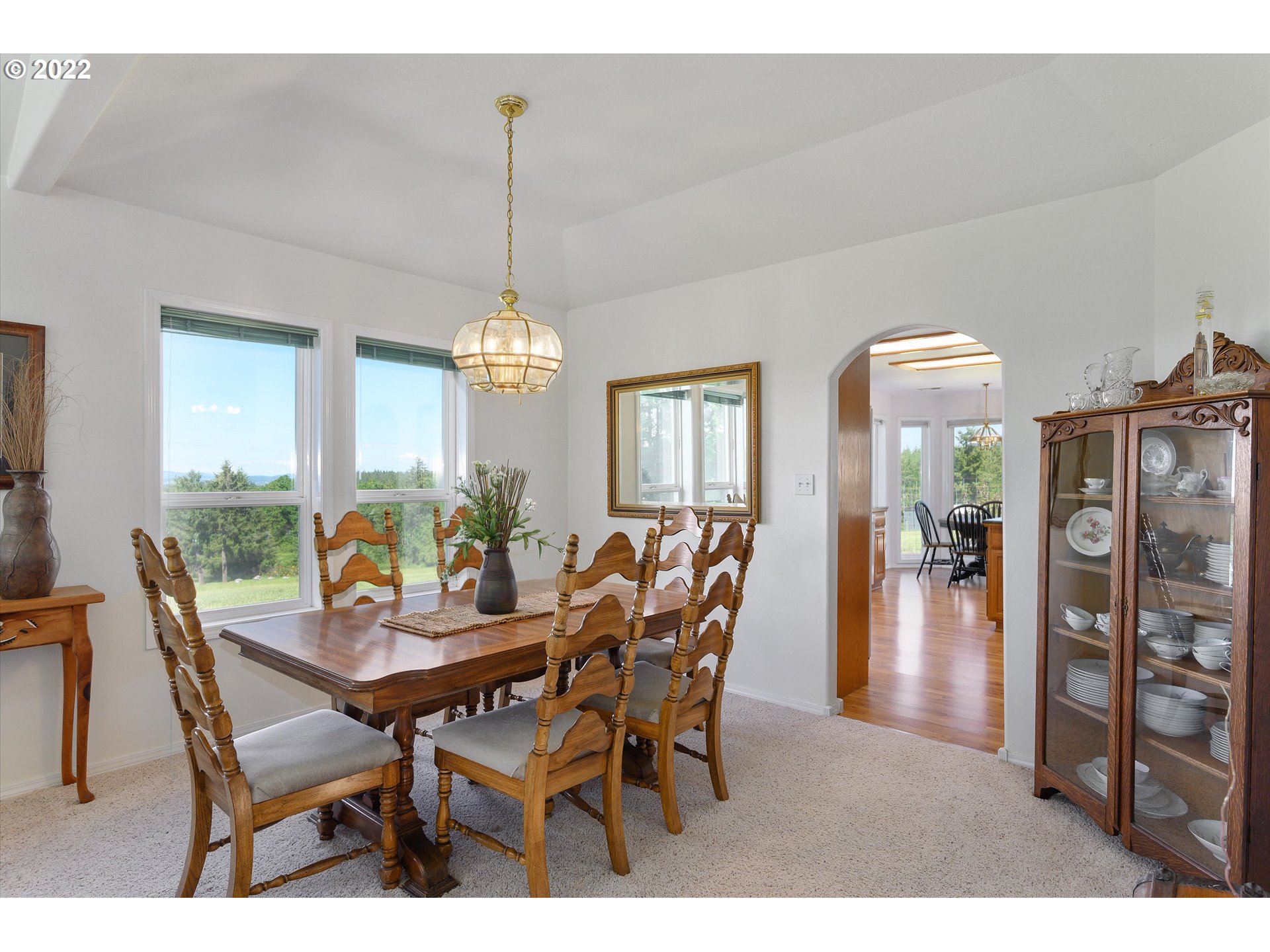16750 Oakdale Road Dallas, OR 97338 - Photo 6 of 32 a dining room with furniture window and wooden floor
