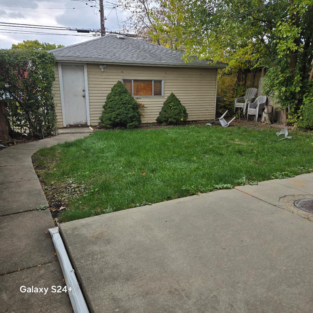 5600 North Mango Avenue Chicago, IL 60646 - Photo 5 of 5 a view of a house with a yard and plants