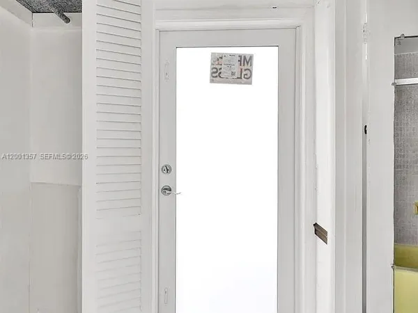 a front view of a building with a fountain