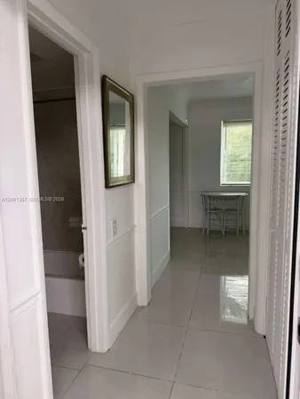 a view of a lake with boats and trees in the background