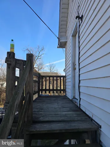 a view of a backyard with sitting area