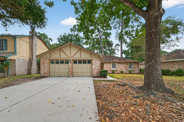 a front view of a house with a yard and pathway