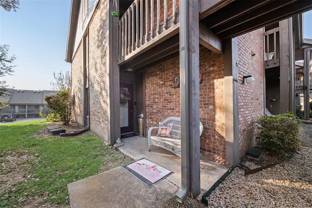 1031 Signal Ridge Place, Unit 1031 Rockwall, TX 75032 - Photo 16 of 20 a front view of a house with a yard