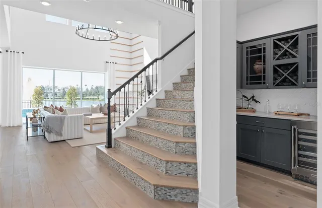 a kitchen with stainless steel appliances kitchen island granite countertop a refrigerator and a stove top oven