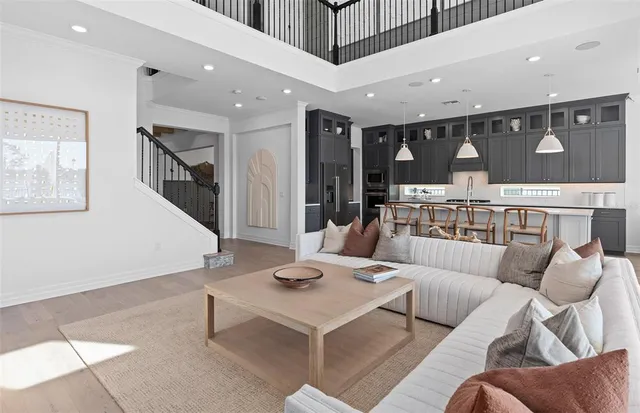 a living room with furniture a lamp and a window