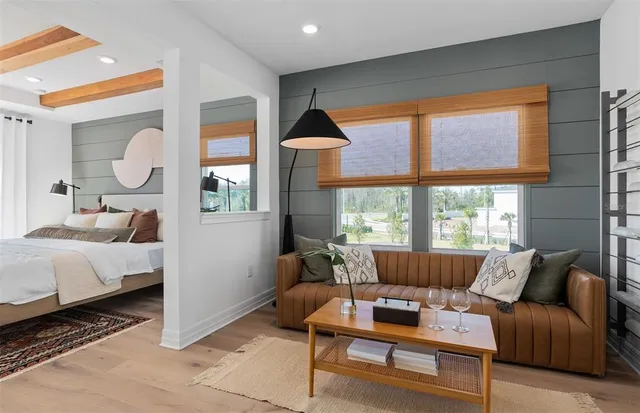 a bedroom with a bed and window