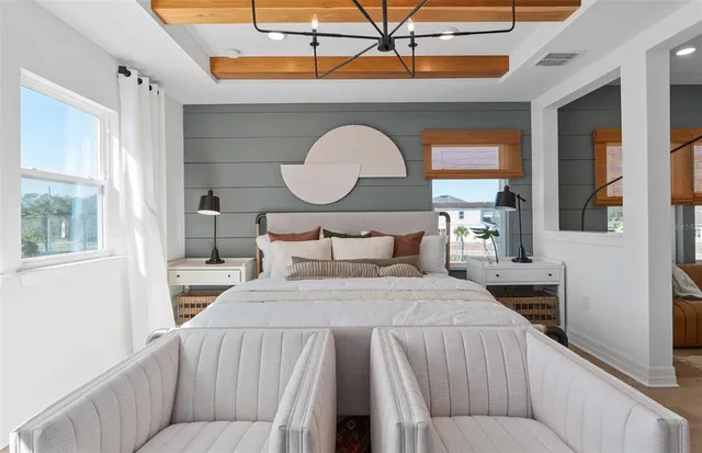 a bathroom with a sink a tub a mirror and window