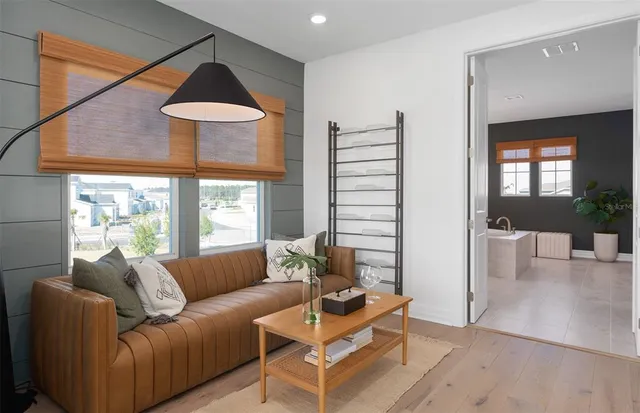 a bathroom with a bathtub a sink and a mirror