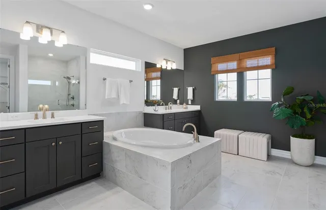 a bathroom with a shower and a sink