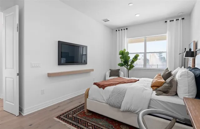 a bedroom with a bed and a dresser