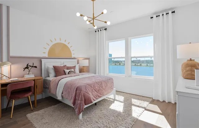 a en suite bathroom with a granite countertop double vanity sink mirror and lamp