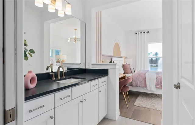 a spacious bedroom with a bed and a couch