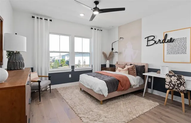 a bathroom with a granite countertop toilet sink and mirror
