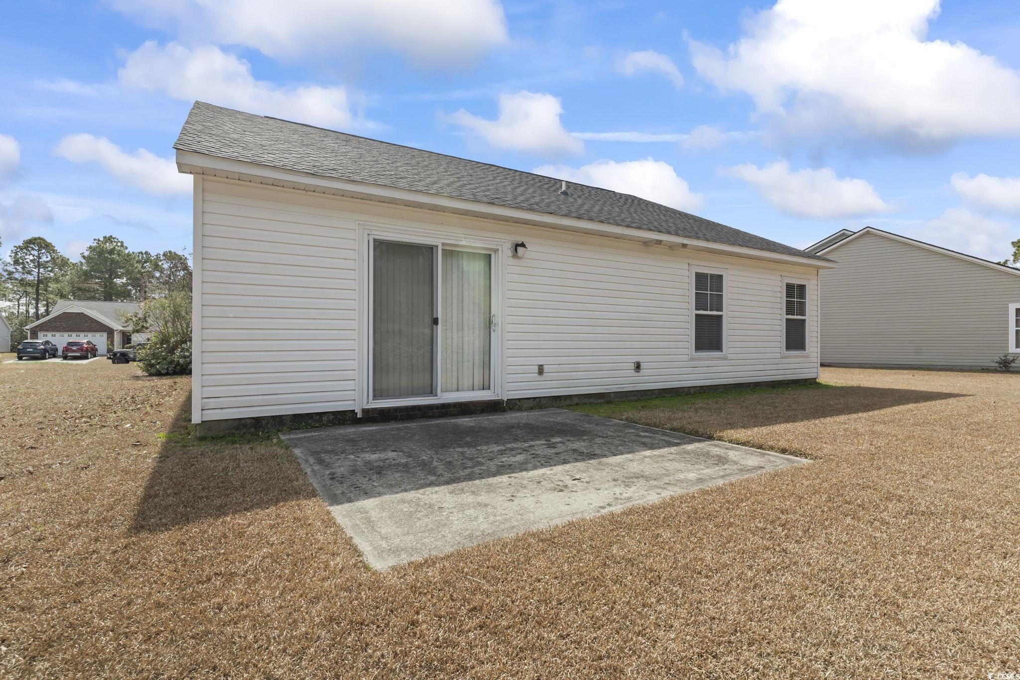 2288 Beauclair Court Myrtle Beach, SC 29579 - Photo 29 of 40 Rear view of property featuring a patio and a shingled roof