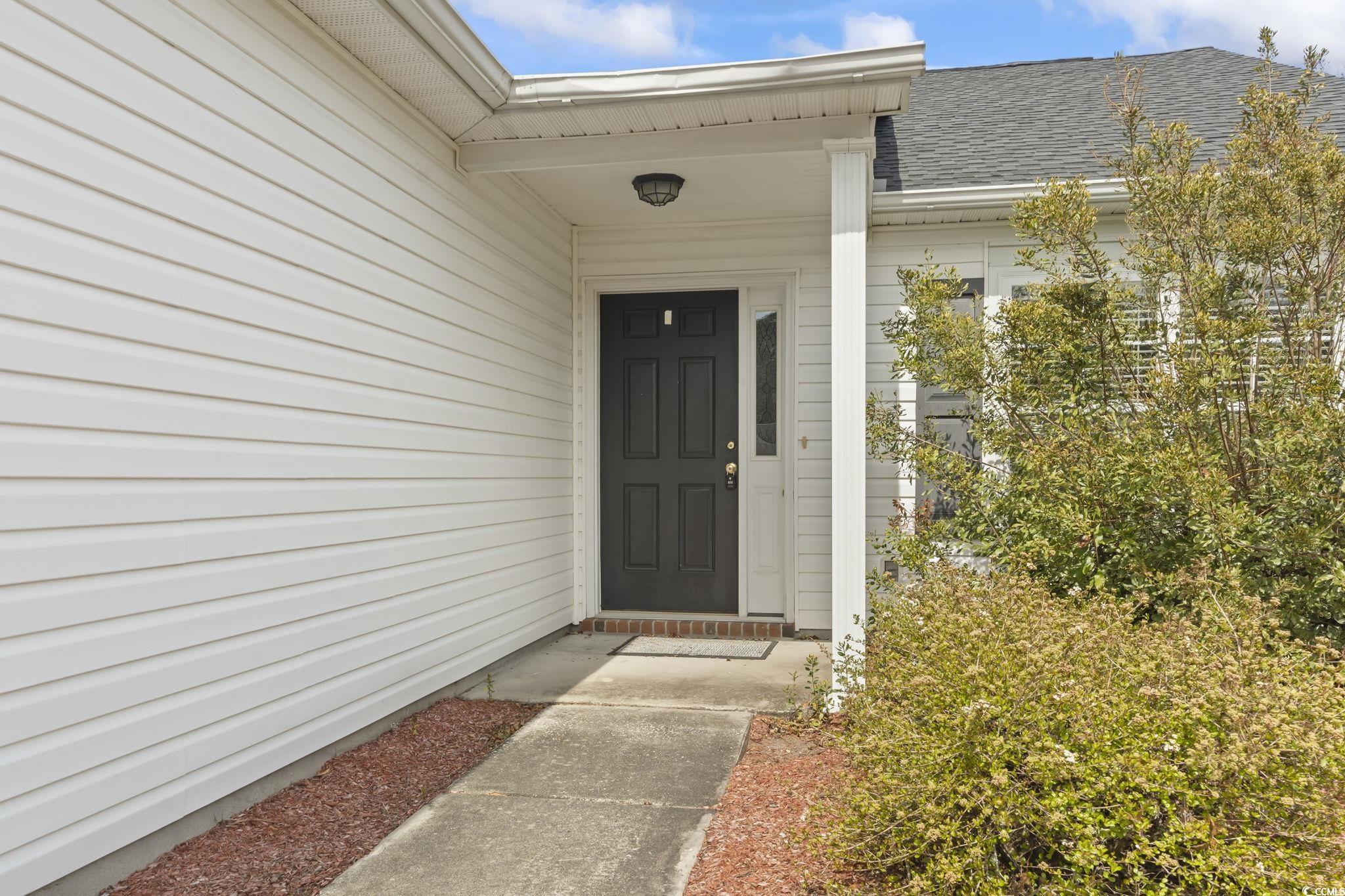 2288 Beauclair Court Myrtle Beach, SC 29579 - Photo 3 of 40 Doorway to property featuring a shingled roof