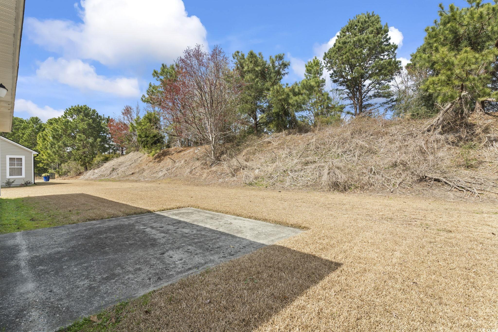 2288 Beauclair Court Myrtle Beach, SC 29579 - Photo 30 of 40 View of yard featuring a patio area
