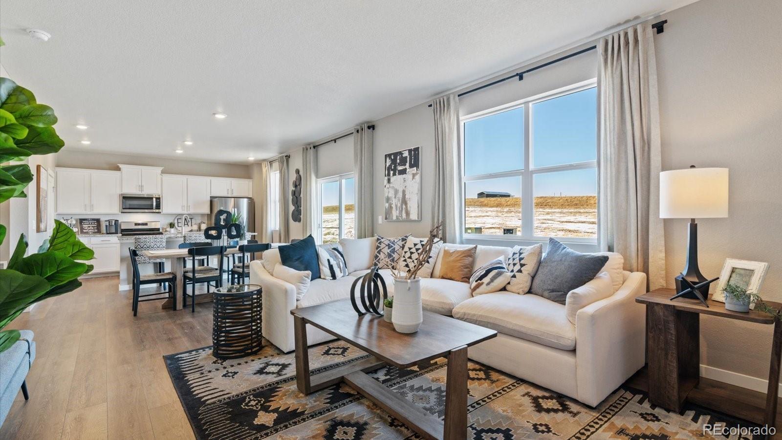 2202 Base Street Fort Lupton, CO 80621 - Photo 12 of 24 a living room with furniture and a table