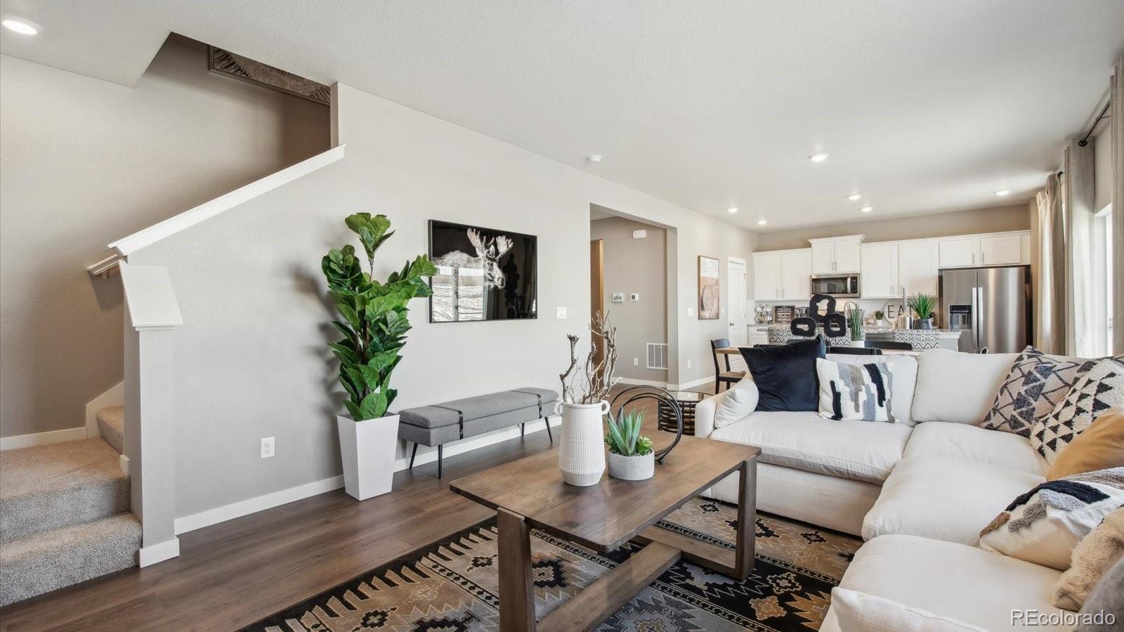 2202 Base Street Fort Lupton, CO 80621 - Photo 14 of 24 a living room with furniture and kitchen view