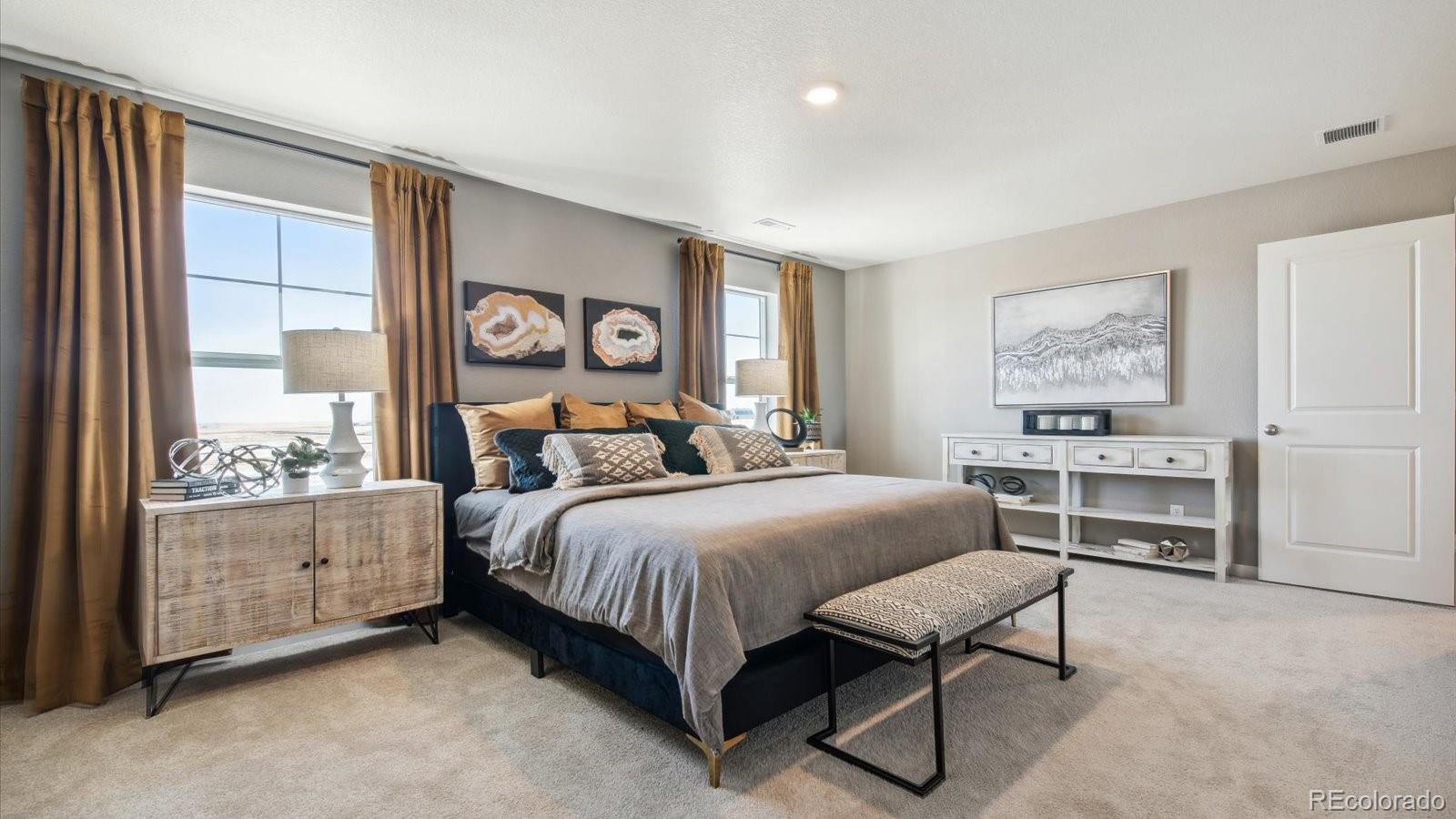 2202 Base Street Fort Lupton, CO 80621 - Photo 19 of 24 a bedroom with a bed and a table