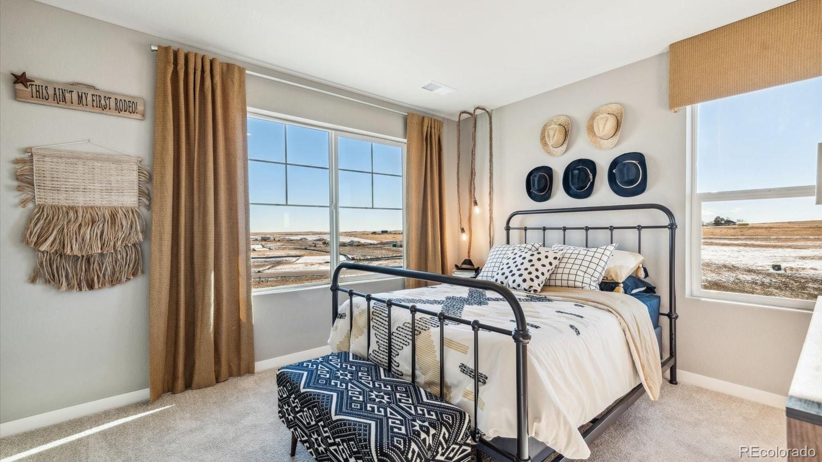 2202 Base Street Fort Lupton, CO 80621 - Photo 22 of 24 a bedroom with a bed and a window