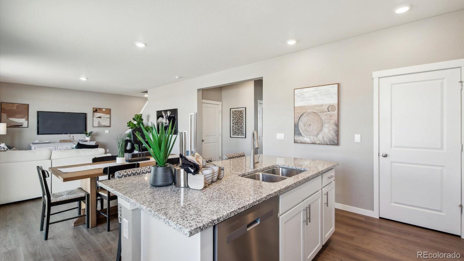 2202 Base Street Fort Lupton, CO 80621 - Photo 5 of 24 a kitchen with sink and view of living room