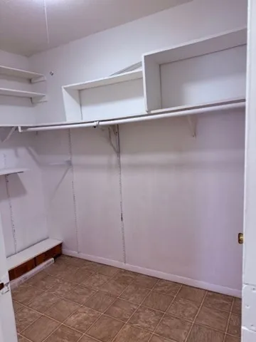 a view of an empty walk in closet