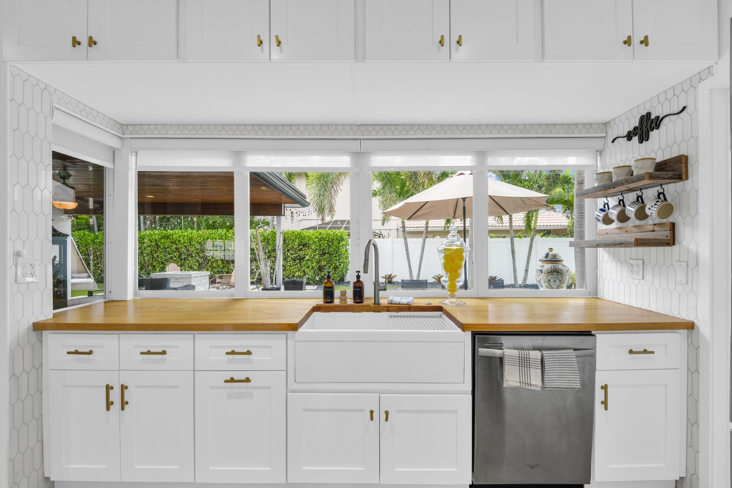 701 Appleby Street Boca Raton, FL 33487 - Photo 8 of 47 a kitchen with a sink and large window