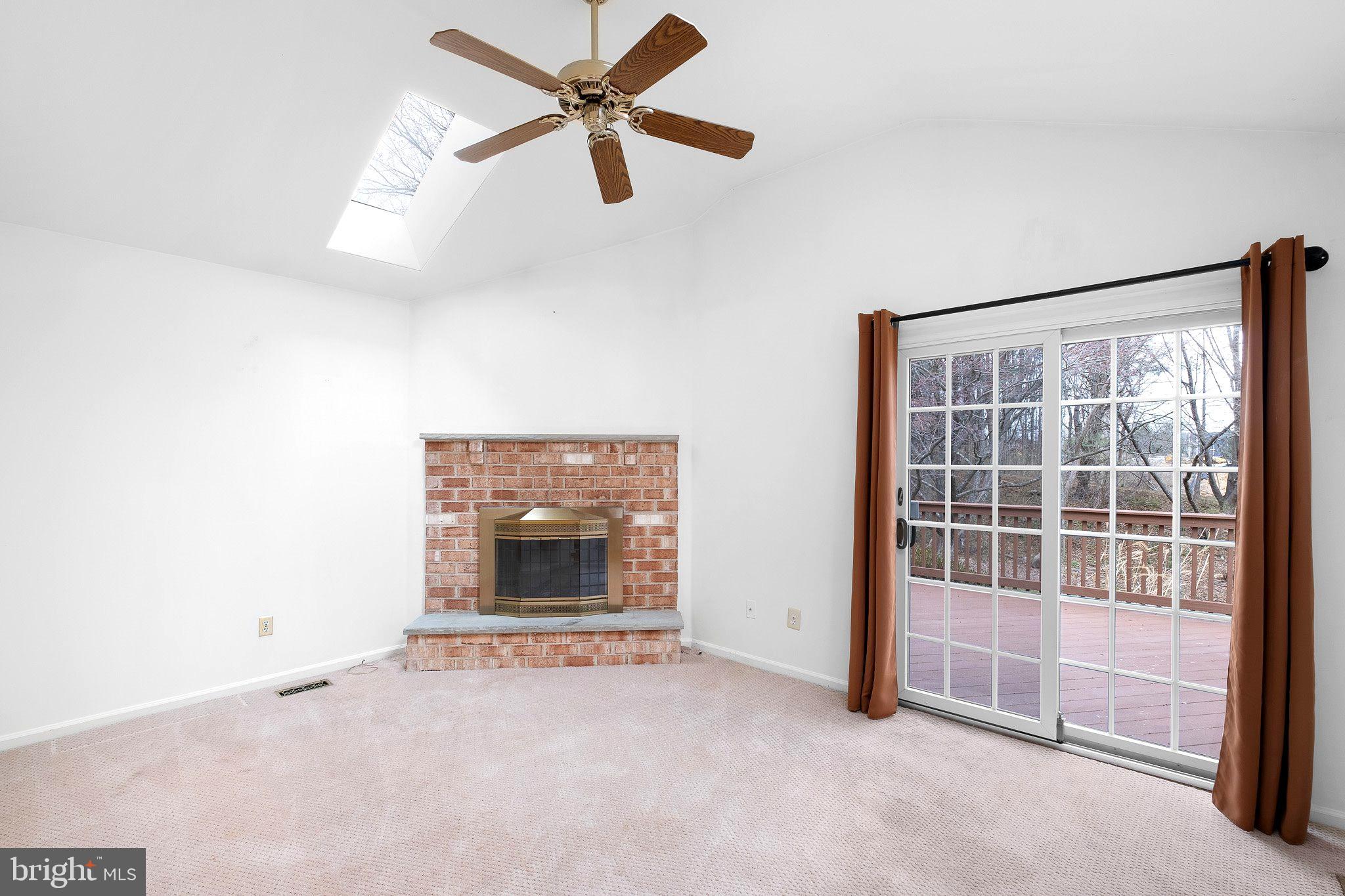 163 Cambridge Circle, Unit 78 Kennett Square, PA 19348 - Photo 12 of 30 an empty room with windows and fan