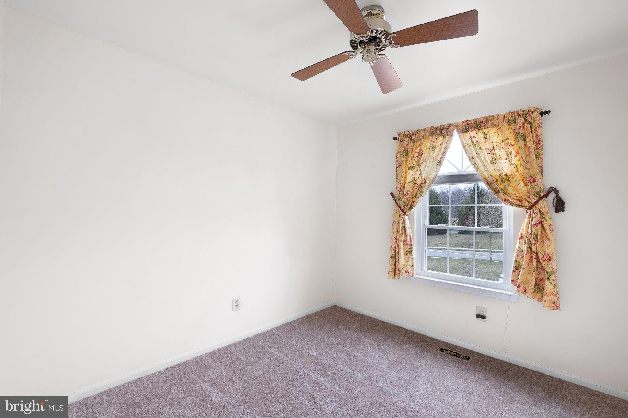 163 Cambridge Circle, Unit 78 Kennett Square, PA 19348 - Photo 23 of 30 an empty room with windows