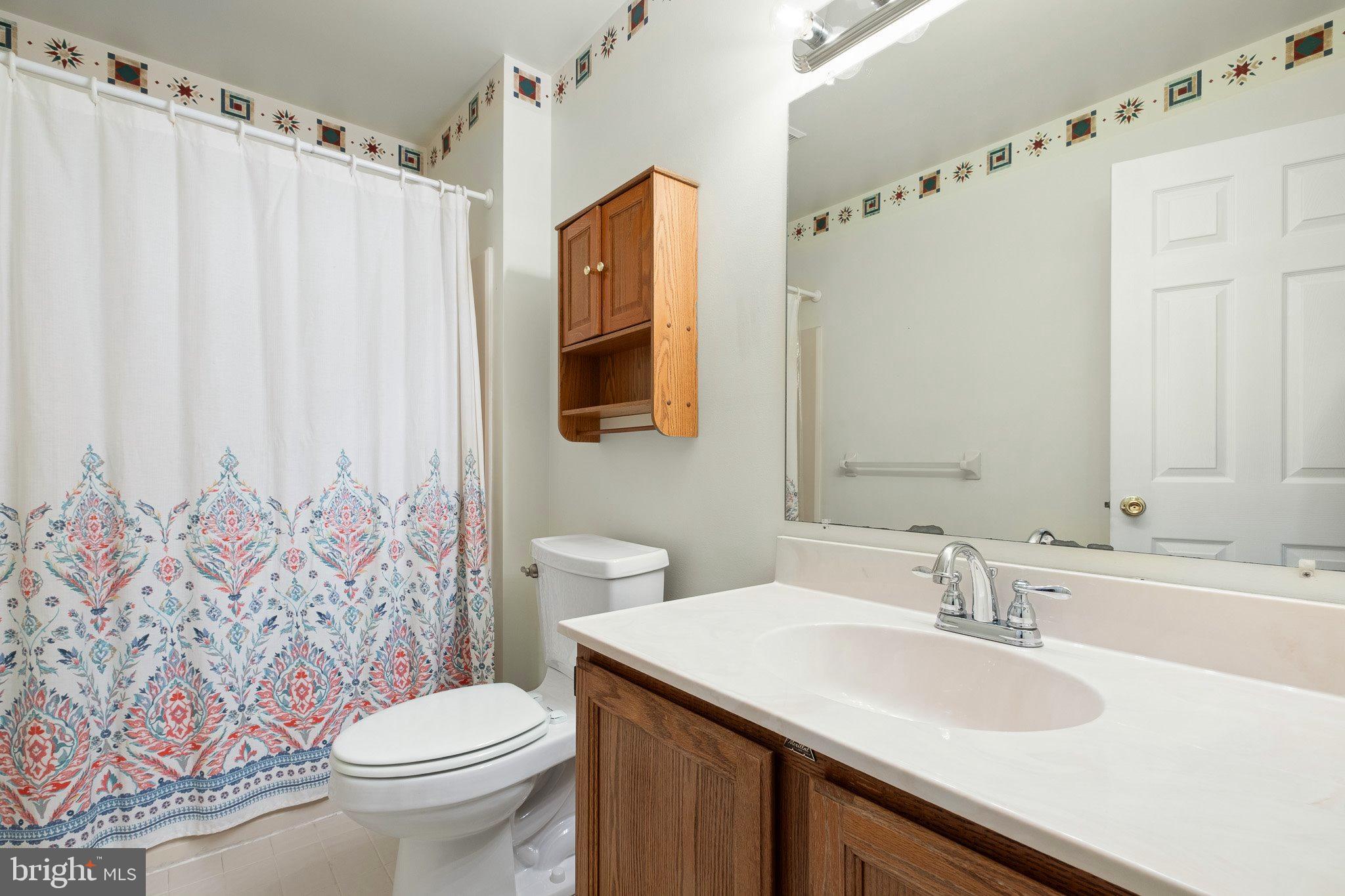 163 Cambridge Circle, Unit 78 Kennett Square, PA 19348 - Photo 24 of 30 a bathroom with a sink toilet and shower