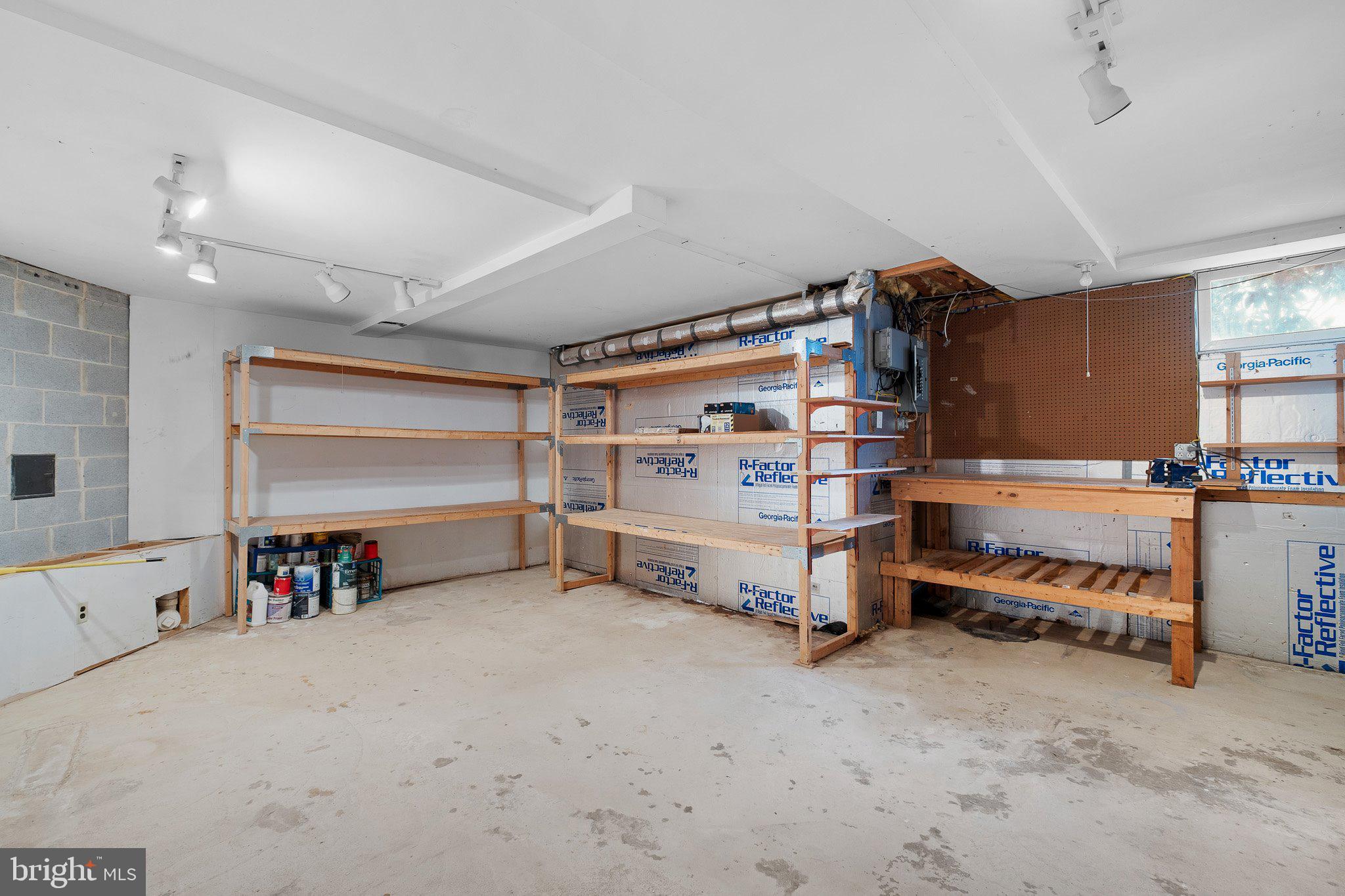 163 Cambridge Circle, Unit 78 Kennett Square, PA 19348 - Photo 28 of 30 a view of a big room with racks shoes and a refrigerator