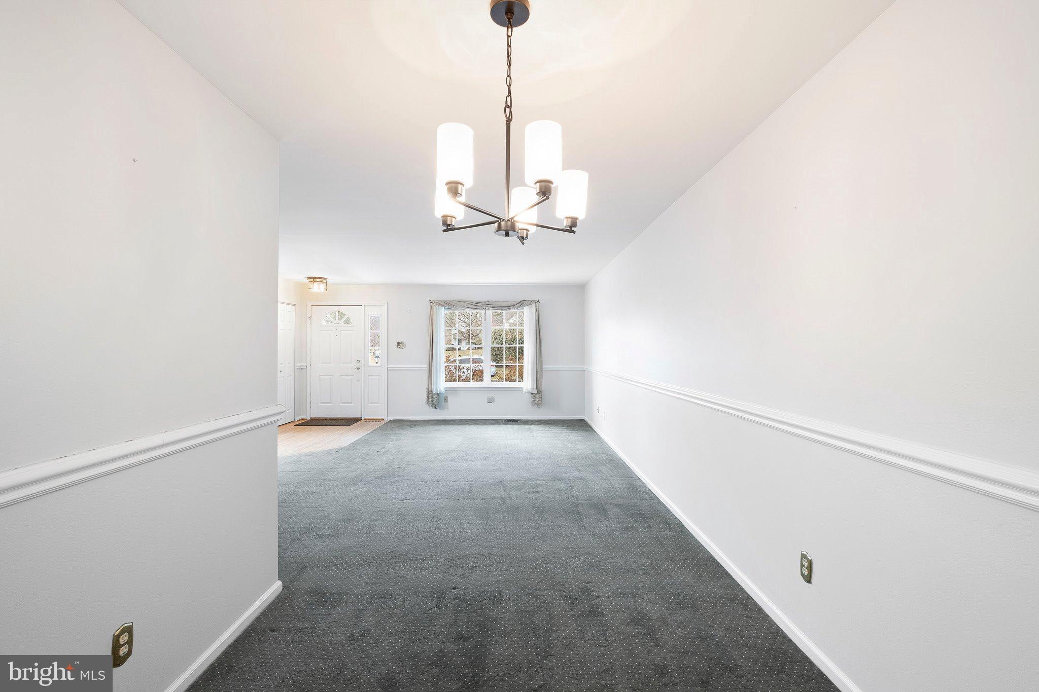 163 Cambridge Circle, Unit 78 Kennett Square, PA 19348 - Photo 5 of 30 a view of a room with a ceiling fan and window