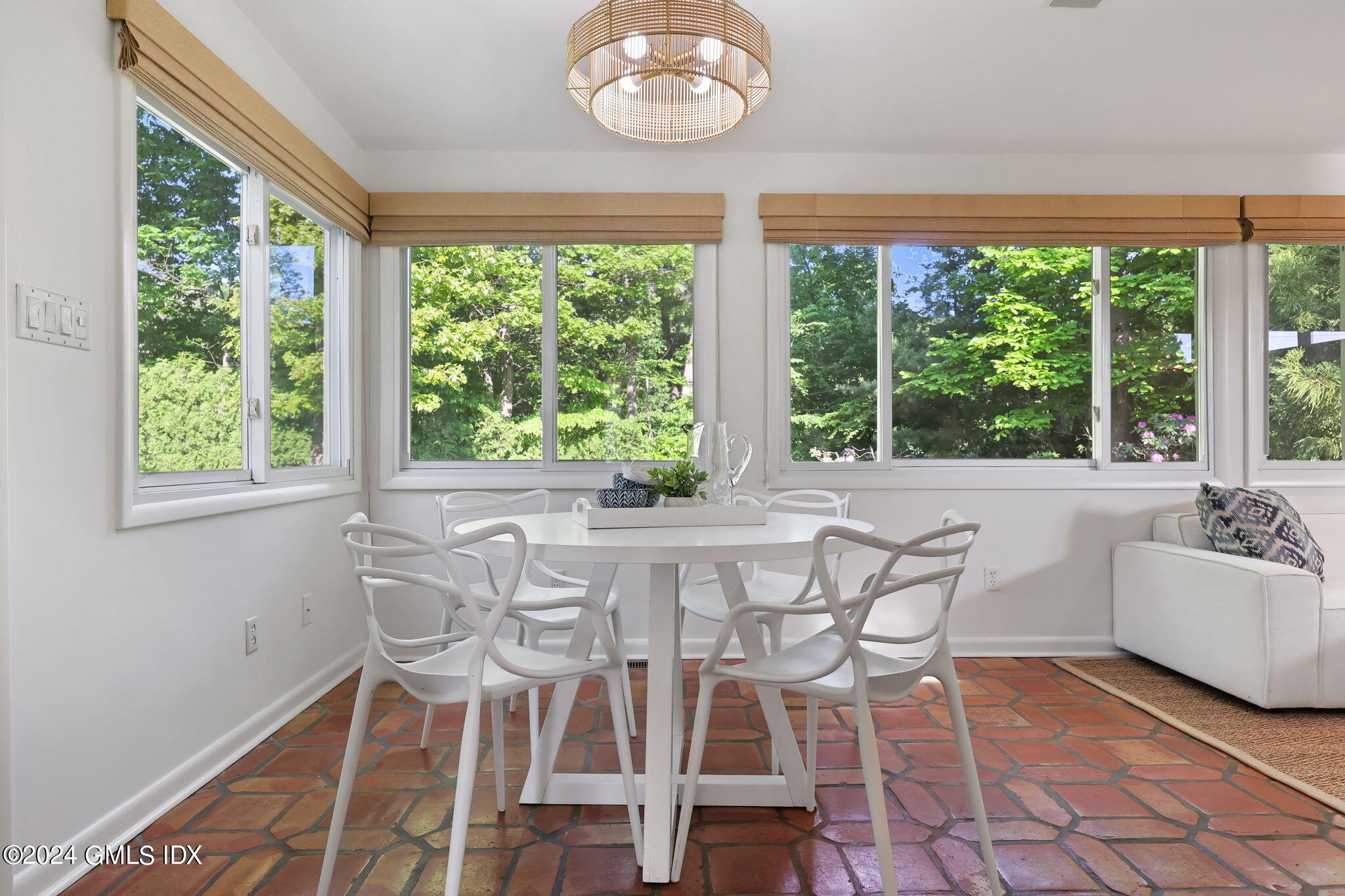 18 Crawford Terrace Riverside, CT 06878 - Photo 11 of 31 a view of a dining room with furniture a chandelier and wooden floor