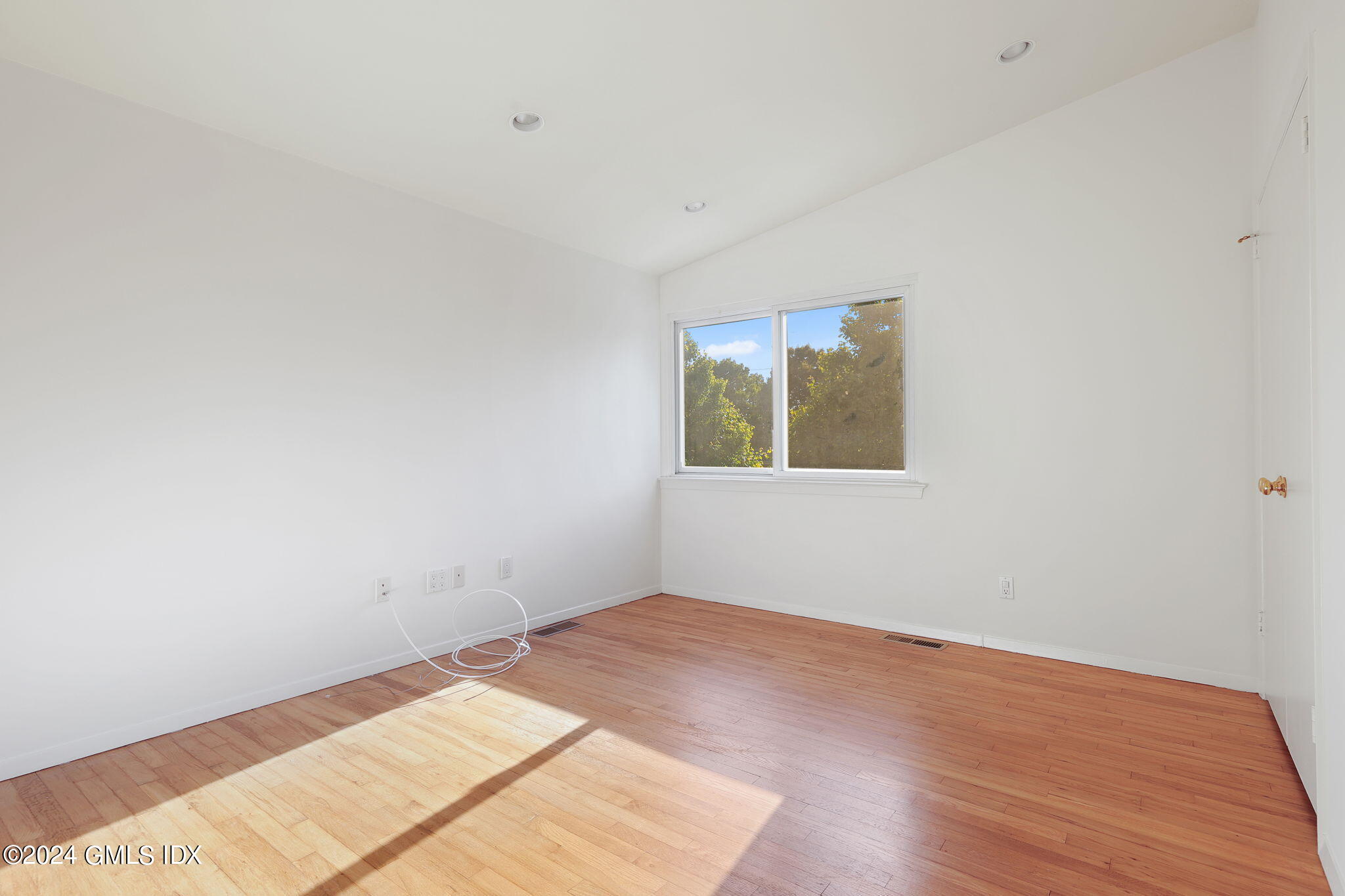18 Crawford Terrace Riverside, CT 06878 - Photo 18 of 31 an empty room with wooden floor and a window