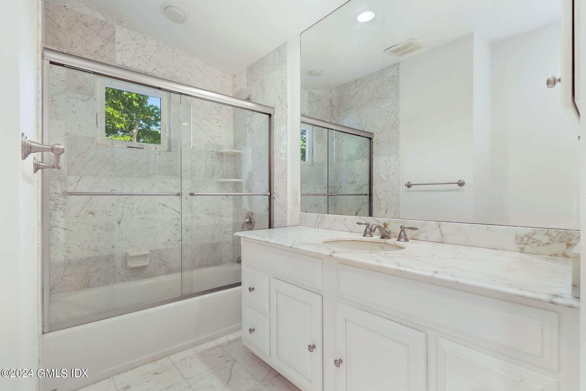 18 Crawford Terrace Riverside, CT 06878 - Photo 20 of 31 a bathroom with a shower sink and mirror