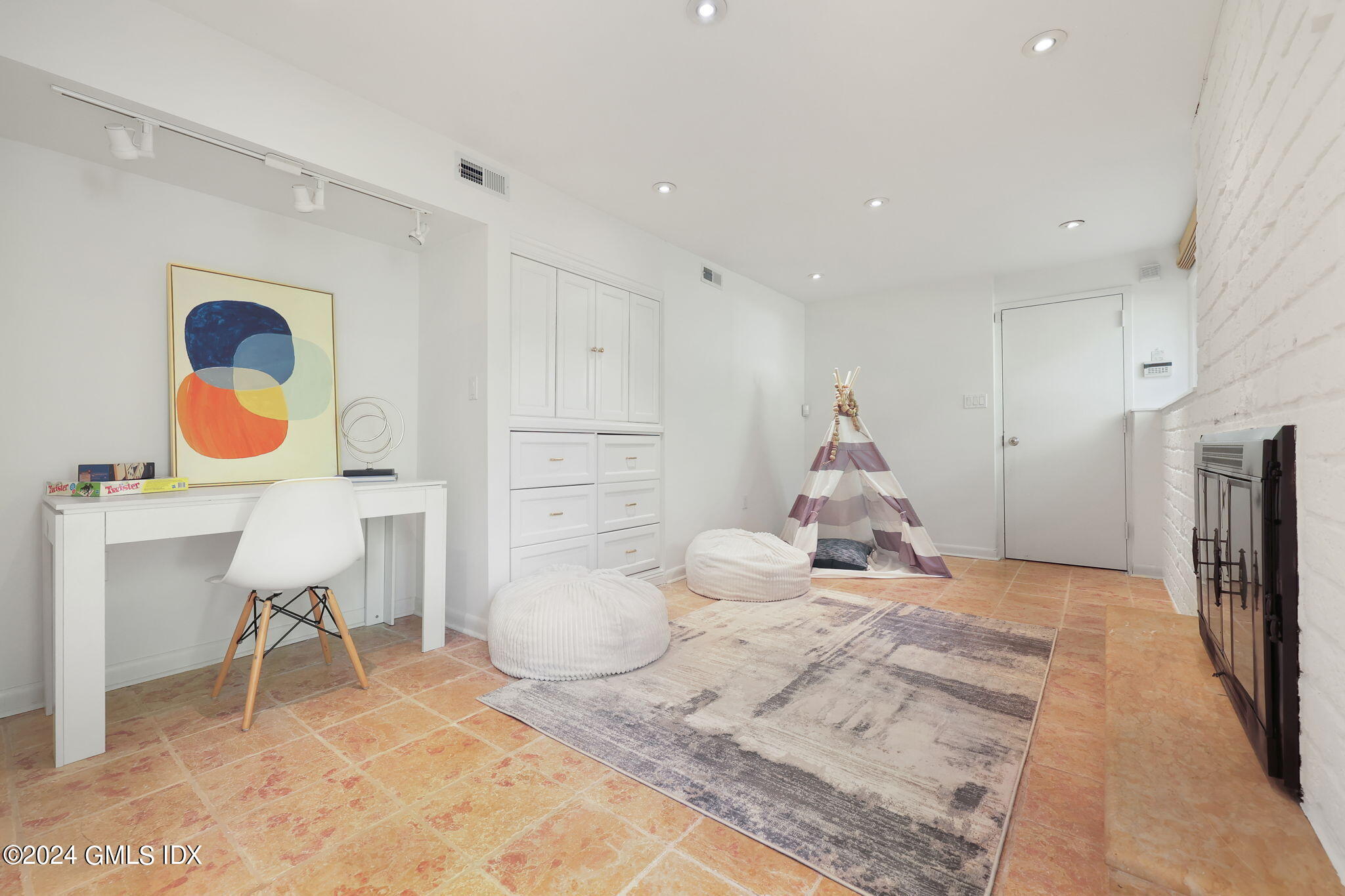 18 Crawford Terrace Riverside, CT 06878 - Photo 22 of 31 a bedroom with a bed and a chandelier