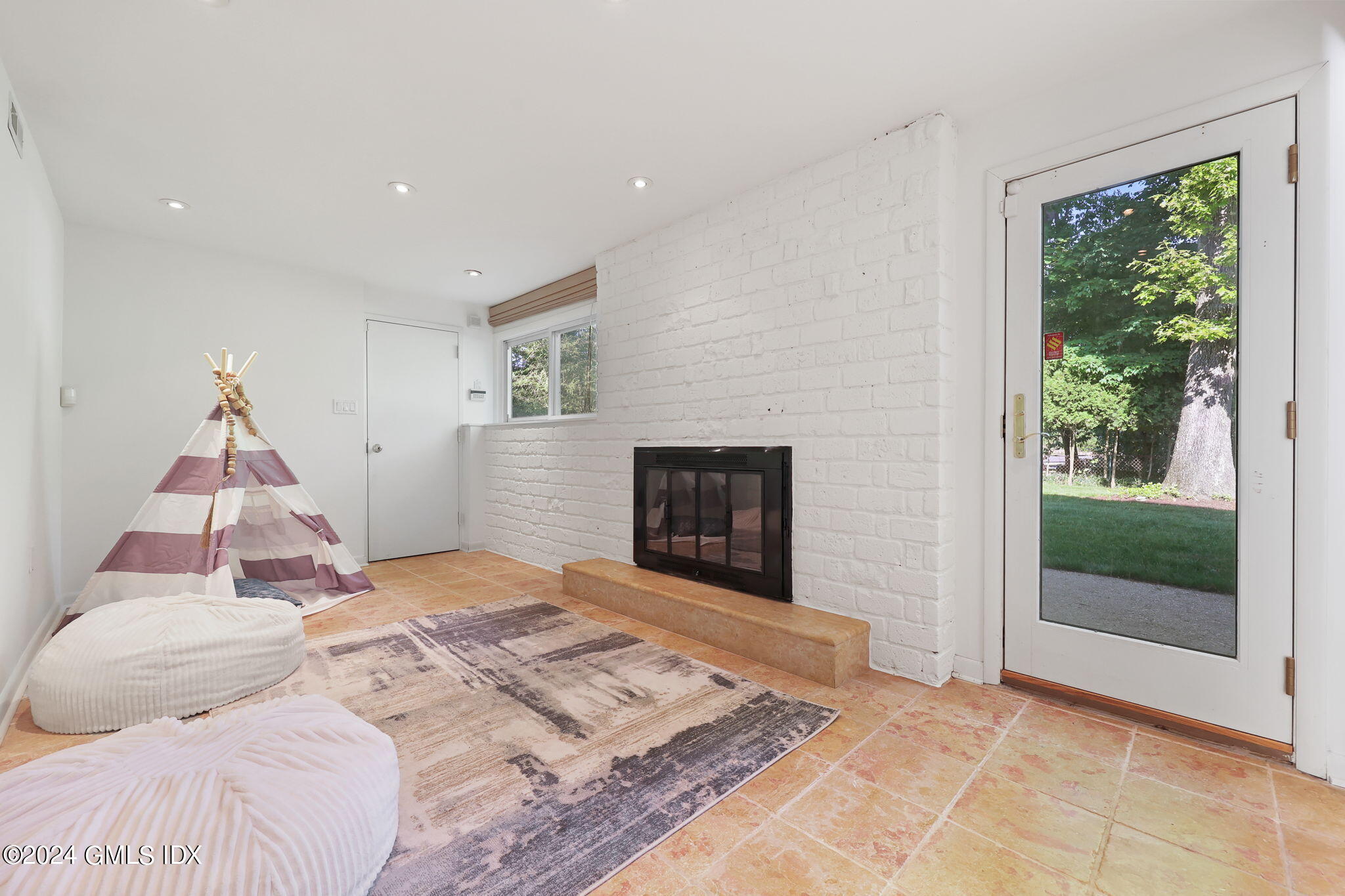 18 Crawford Terrace Riverside, CT 06878 - Photo 23 of 31 a bedroom with a bed and a fireplace