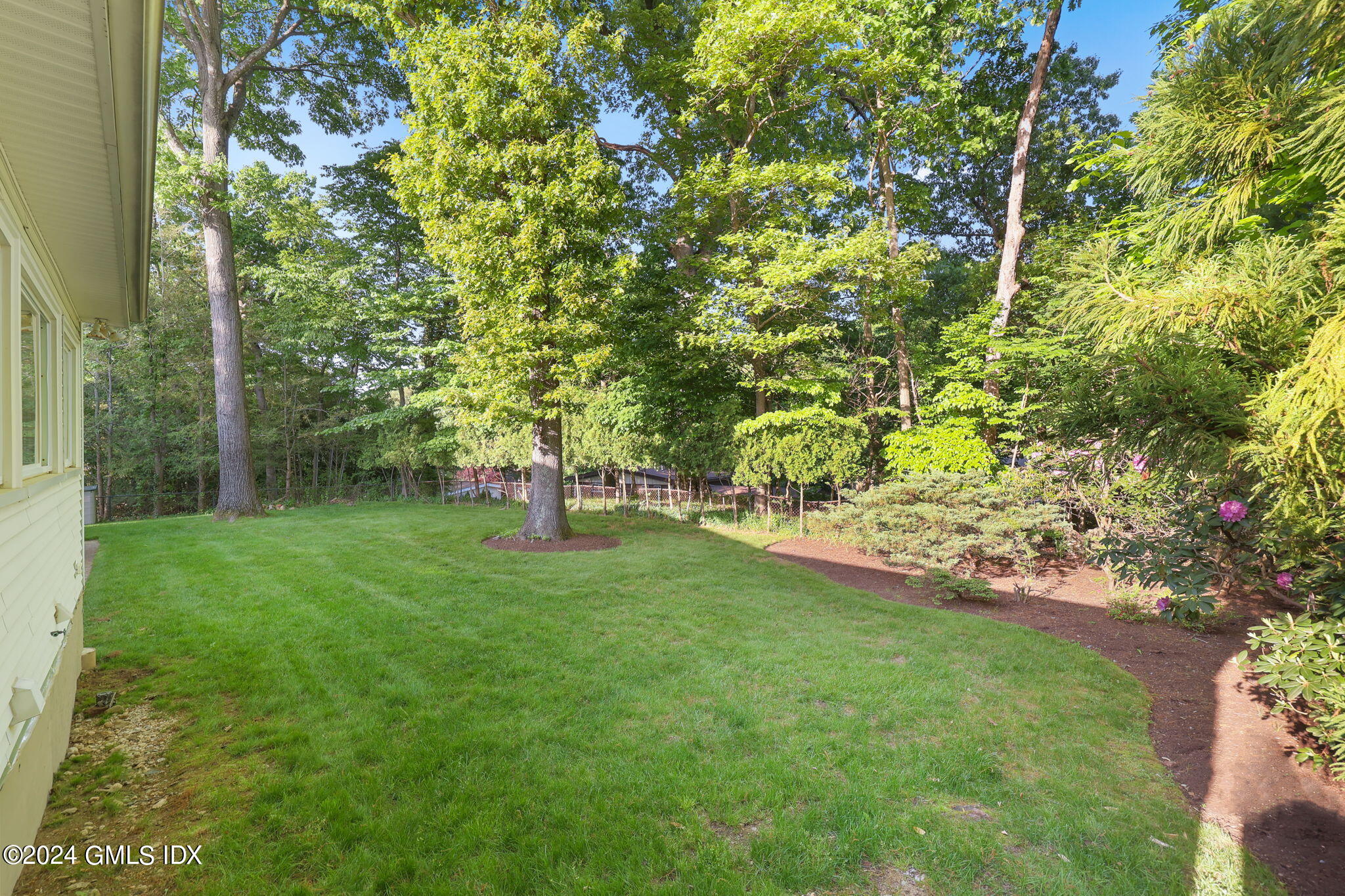 18 Crawford Terrace Riverside, CT 06878 - Photo 27 of 31 a view of a backyard with large trees
