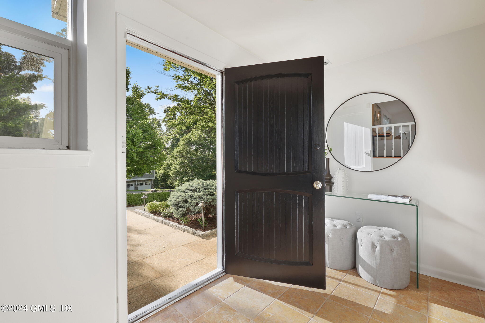 18 Crawford Terrace Riverside, CT 06878 - Photo 3 of 31 a front view of a house with garden